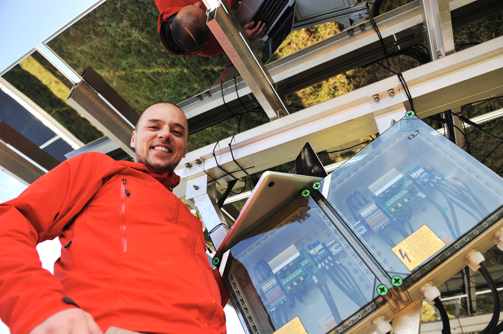 Engineer working with laptop installing  solar panels-1